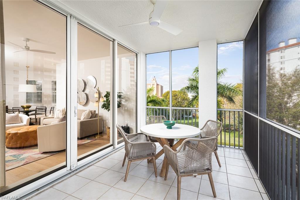 470 Launch Circle, Unit V401 Naples, FL 34108 - Photo 16 of 32 a view of a dining room with furniture window and outside view