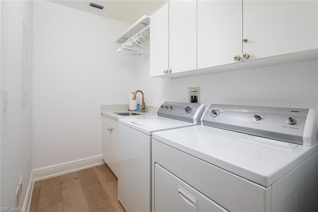 470 Launch Circle, Unit V401 Naples, FL 34108 - Photo 18 of 32 a utility room with dryer and washer