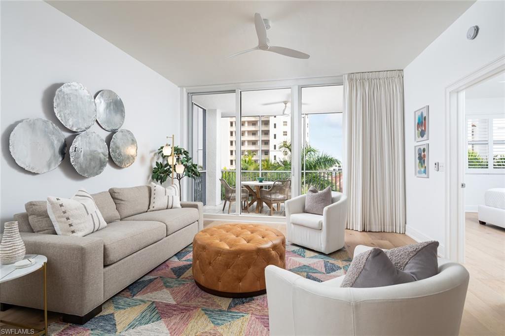 470 Launch Circle, Unit V401 Naples, FL 34108 - Photo 3 of 32 a living room with furniture and a large window