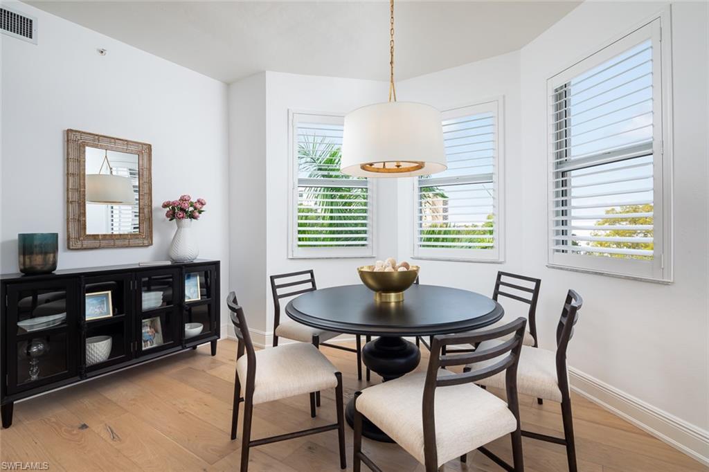 470 Launch Circle, Unit V401 Naples, FL 34108 - Photo 10 of 32 a dining room with furniture and window