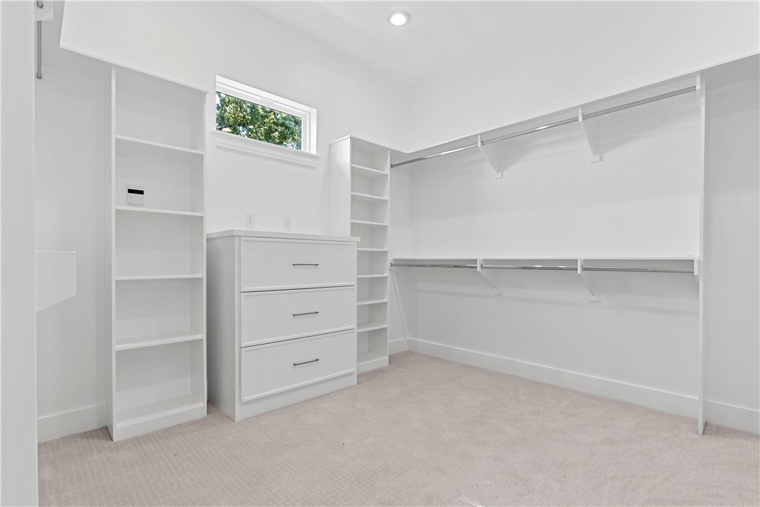 10717 Harvey Ranch Road College Station, TX 77845 - Photo 26 of 48 Primary Closet w/ Metal Rods
