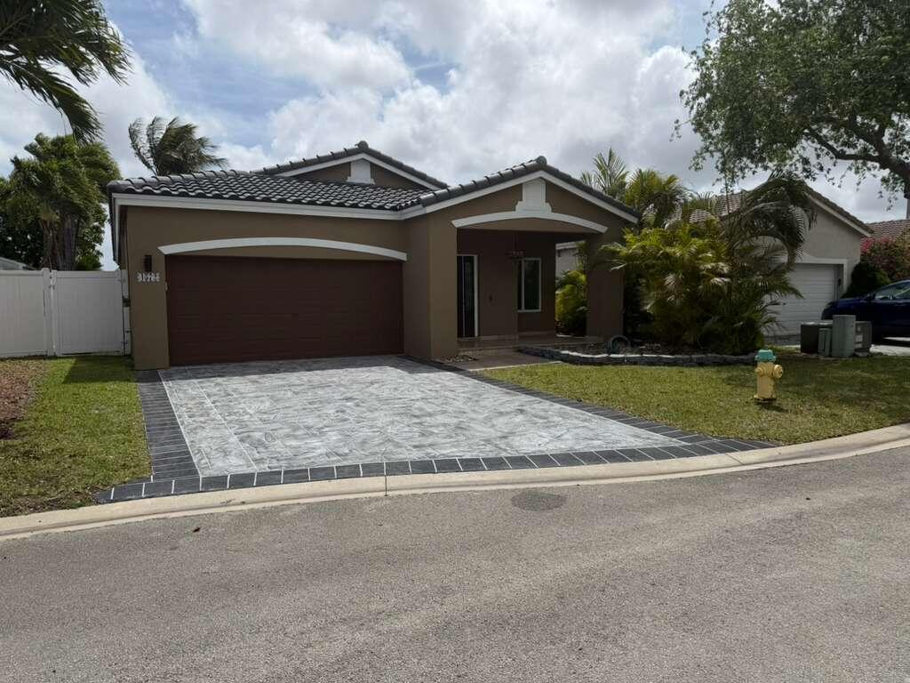 4572 Southwest 14th Street Deerfield Beach, FL 33442 - Photo 2 of 81 front view of a house with a yard