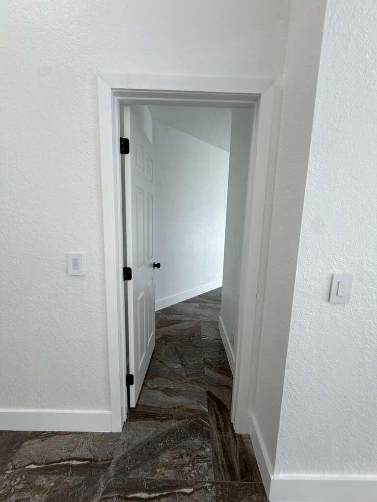 4572 Southwest 14th Street Deerfield Beach, FL 33442 - Photo 24 of 81 a view of a hallway with wooden floor and entryway