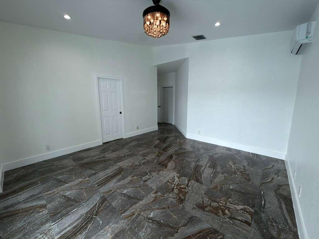 4572 Southwest 14th Street Deerfield Beach, FL 33442 - Photo 27 of 81 a view of an entryway with a table and chairs