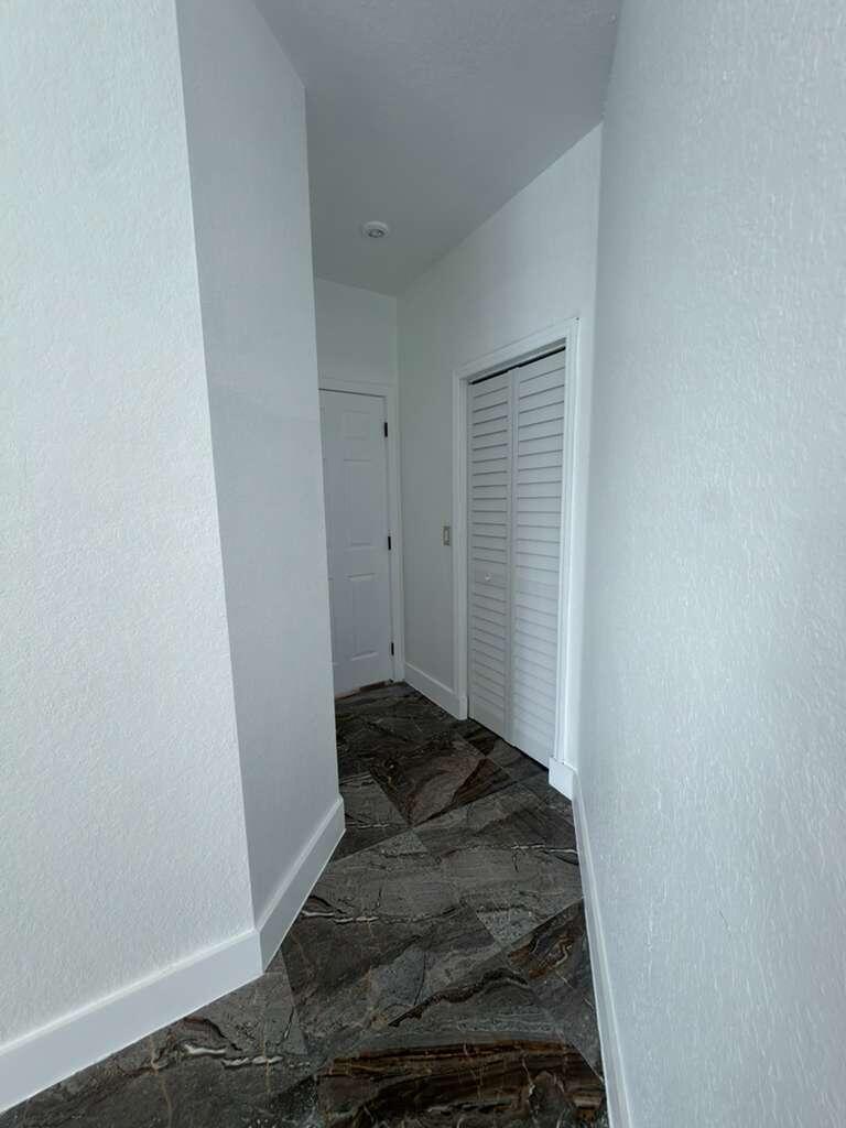 4572 Southwest 14th Street Deerfield Beach, FL 33442 - Photo 28 of 81 a bedroom with a bed and a window