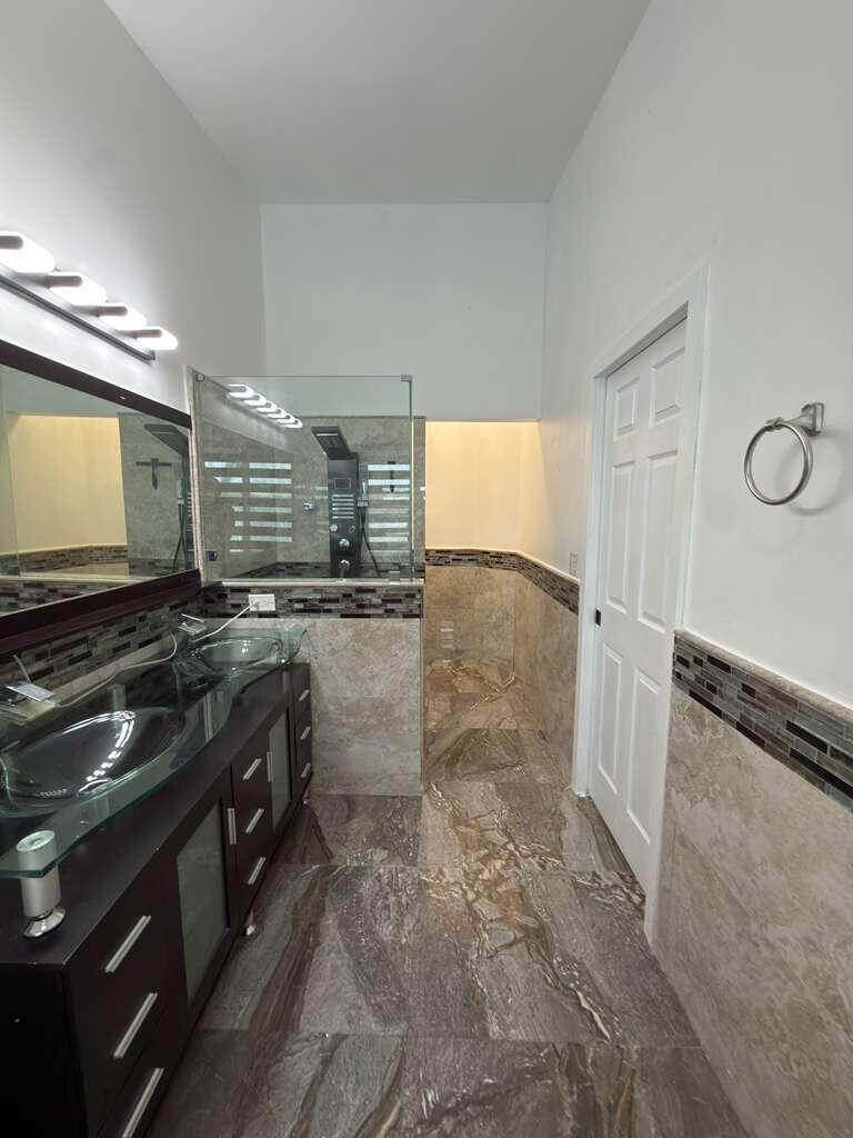4572 Southwest 14th Street Deerfield Beach, FL 33442 - Photo 35 of 81 a view of a kitchen with granite countertop a sink and a stove