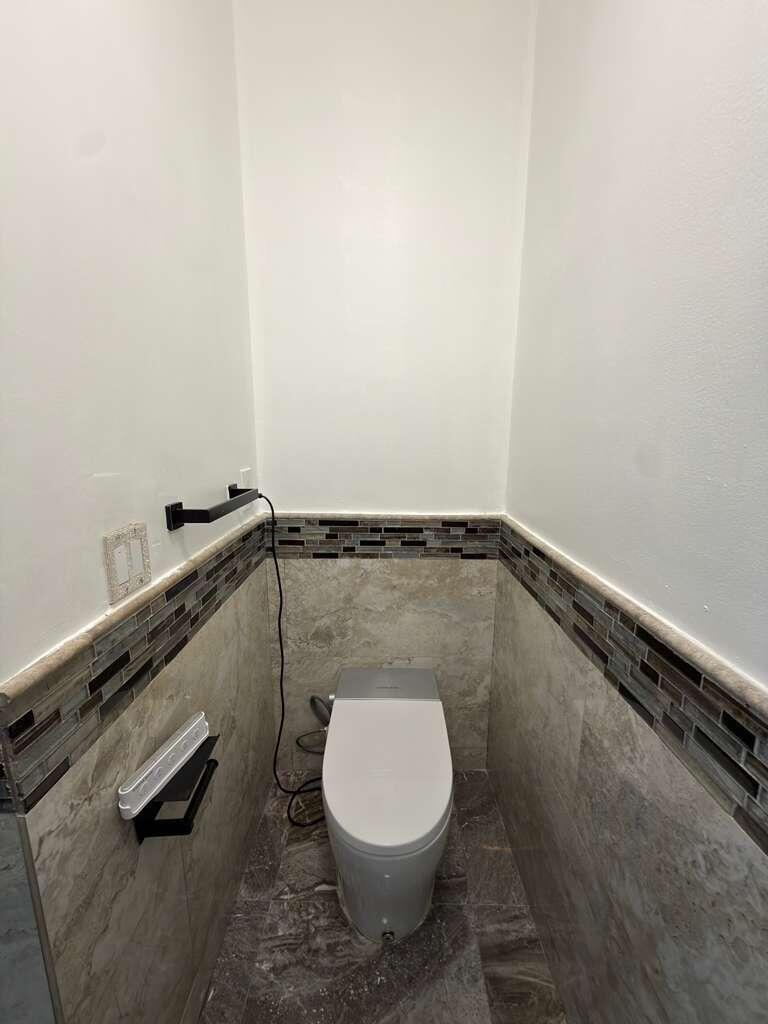 4572 Southwest 14th Street Deerfield Beach, FL 33442 - Photo 36 of 81 a close view of a toilet in a bathroom