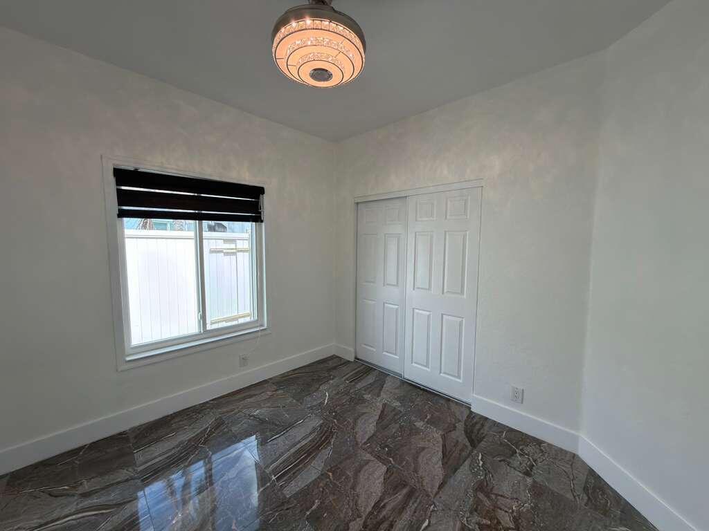 4572 Southwest 14th Street Deerfield Beach, FL 33442 - Photo 45 of 81 an empty room with windows