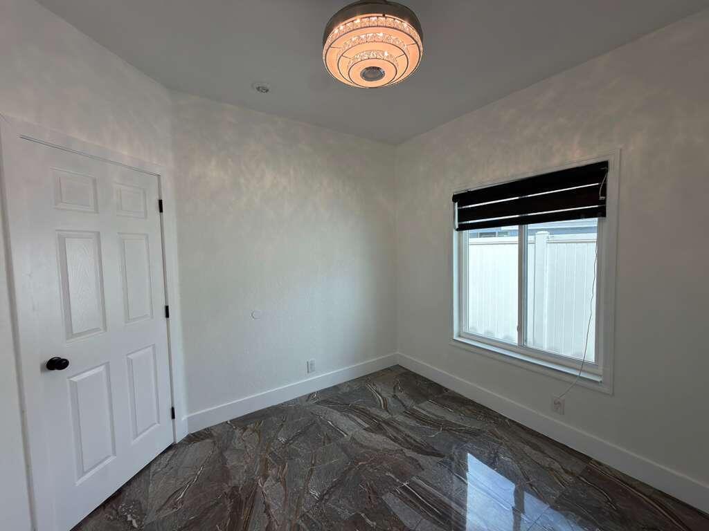 4572 Southwest 14th Street Deerfield Beach, FL 33442 - Photo 47 of 81 a view of empty room with window and fan