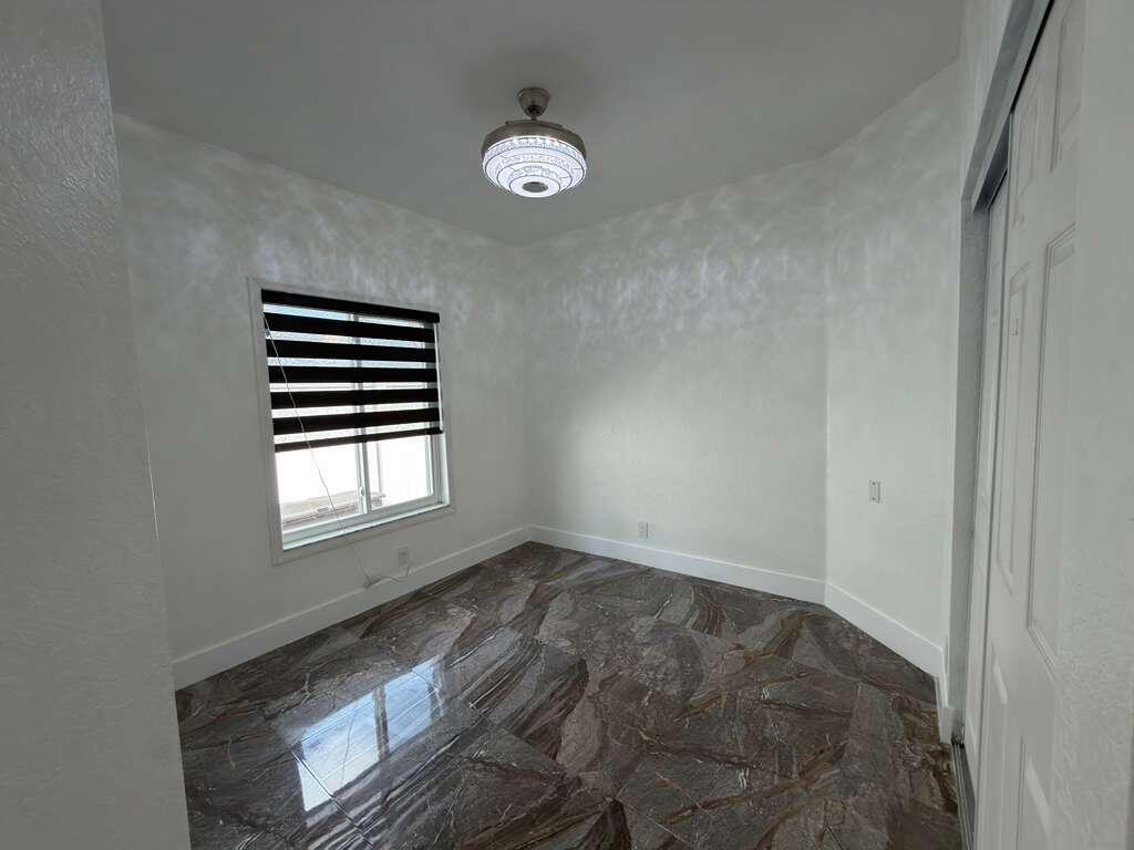4572 Southwest 14th Street Deerfield Beach, FL 33442 - Photo 50 of 81 a view of empty room with windows