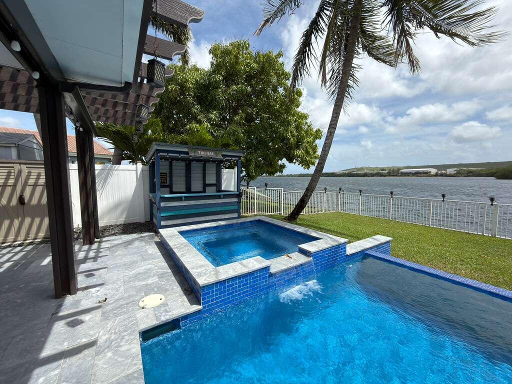 4572 Southwest 14th Street Deerfield Beach, FL 33442 - Photo 63 of 81 a view of a backyard with swimming pool