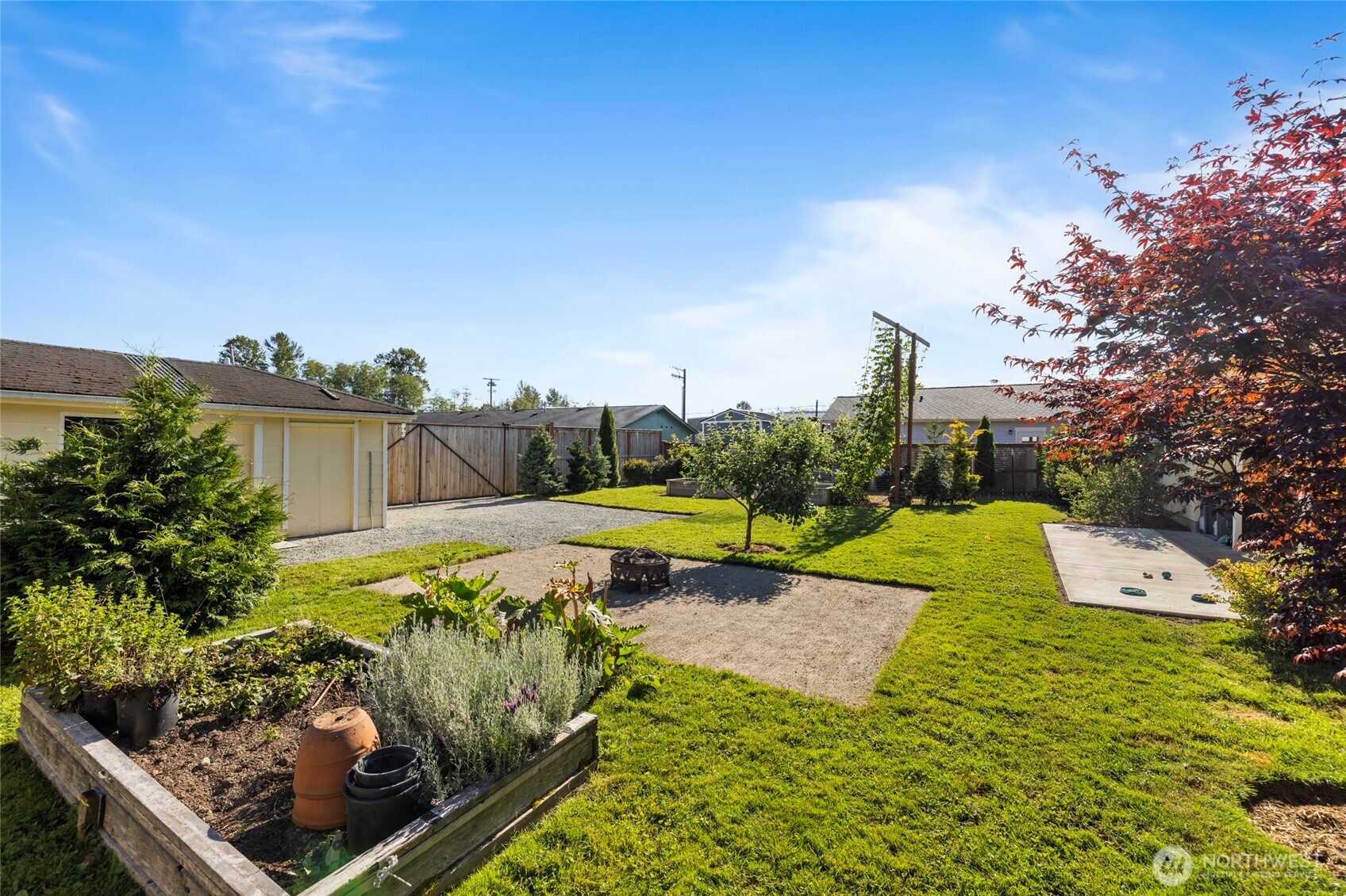 415 Sterling Street Sedro-Woolley, WA 98284 - Photo 5 of 38 a view of a swimming pool with a patio and a yard