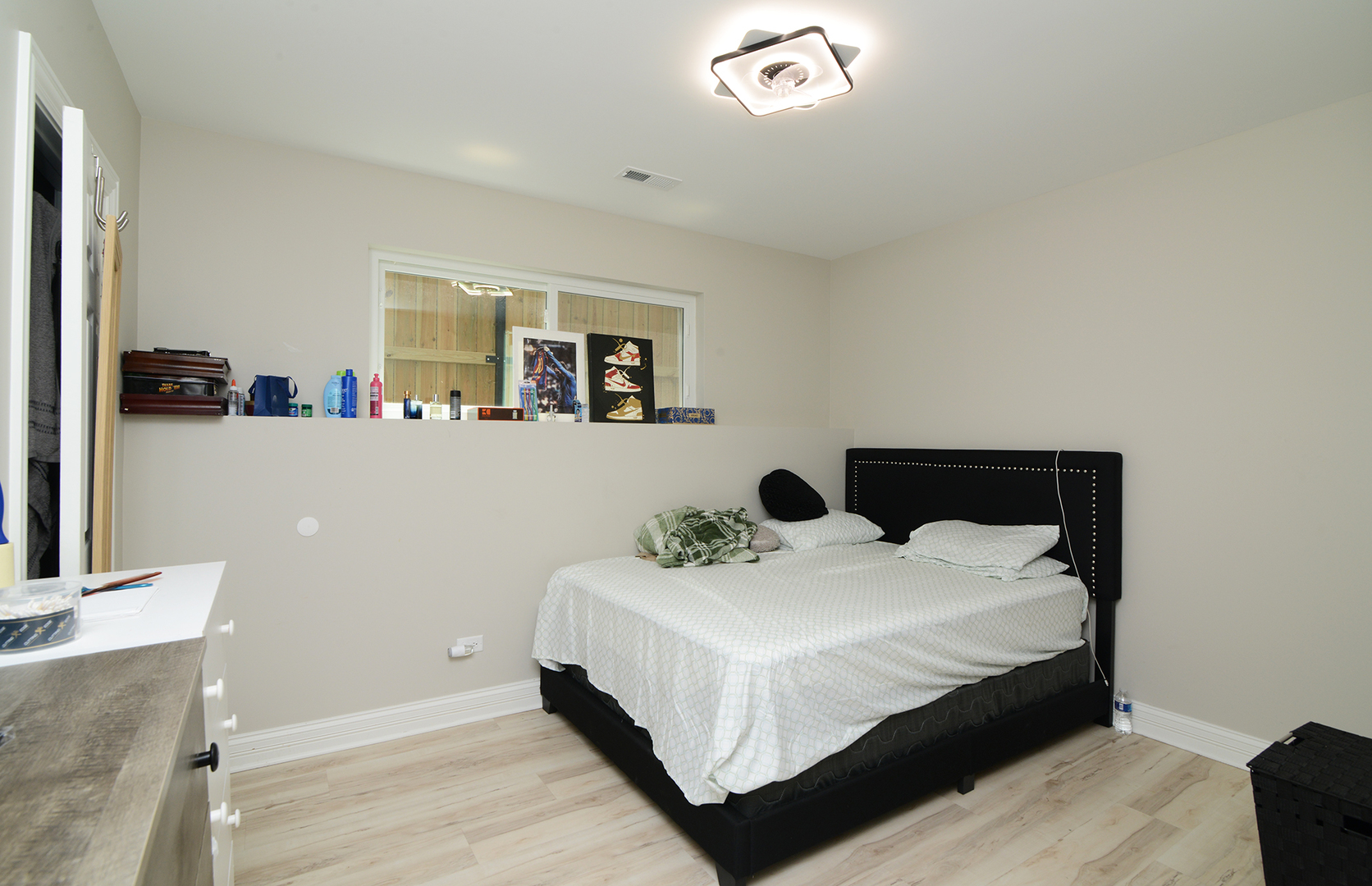 1051 North Springfield Avenue Chicago, IL 60651 - Photo 36 of 50 a bedroom with a bed and window