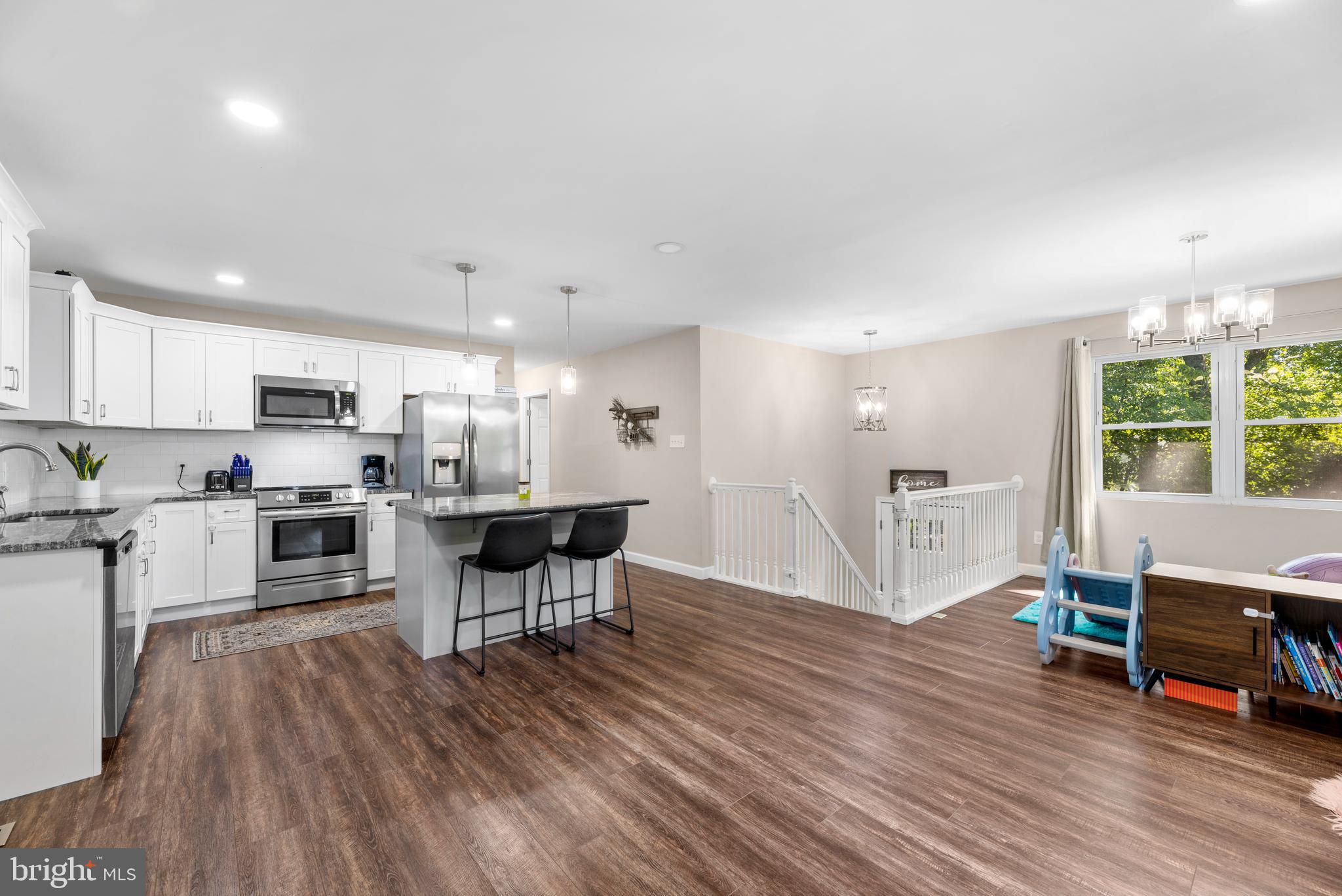 5756 Stephen Reid Road Huntingtown, MD 20639 - Photo 10 of 42 a living room with stainless steel appliances furniture and wooden floor