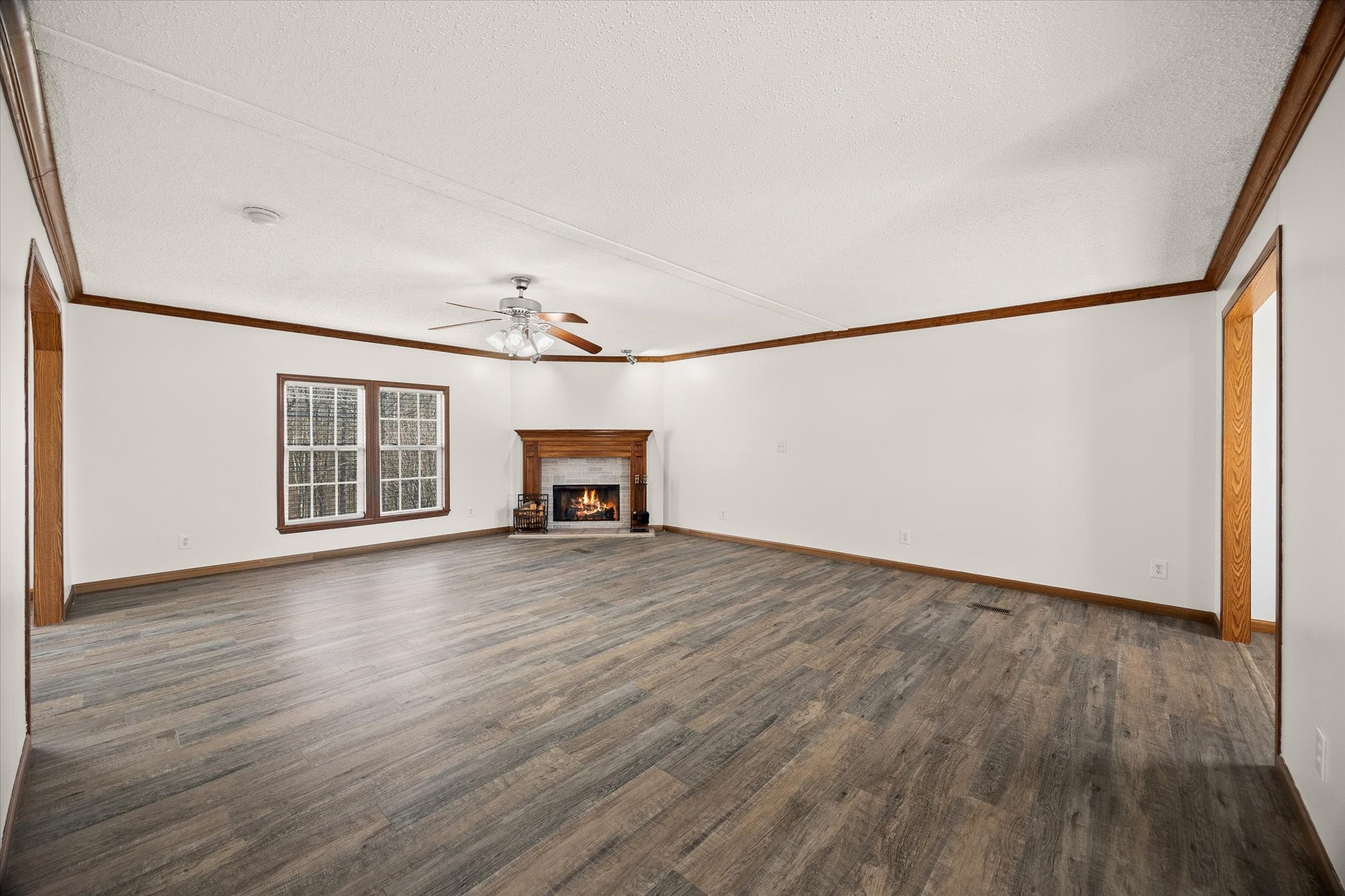 8533 Chaffin Road Baxter, TN 38544 - Photo 8 of 24 a view of an empty room with wooden floor and a window