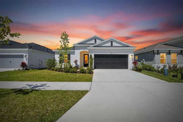 front view of a house with a yard