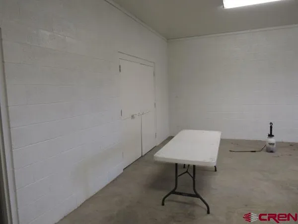 a room with a table and chairs