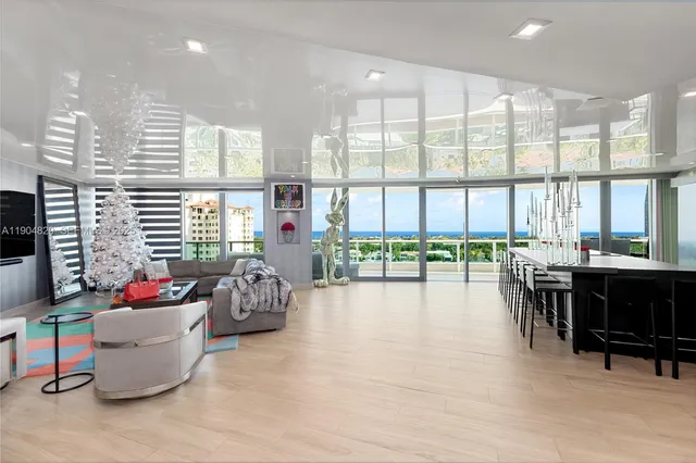 a room with furniture and a large window