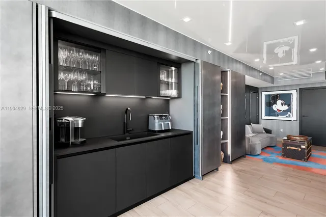 a view of a livingroom with furniture and a large window