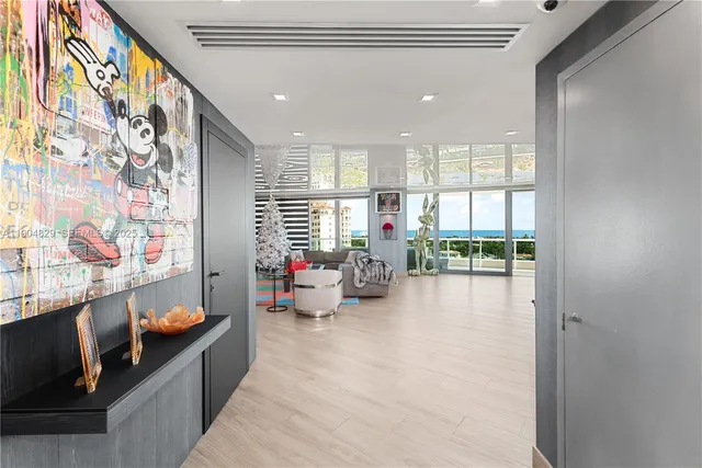 a lobby with furniture and floor to ceiling window