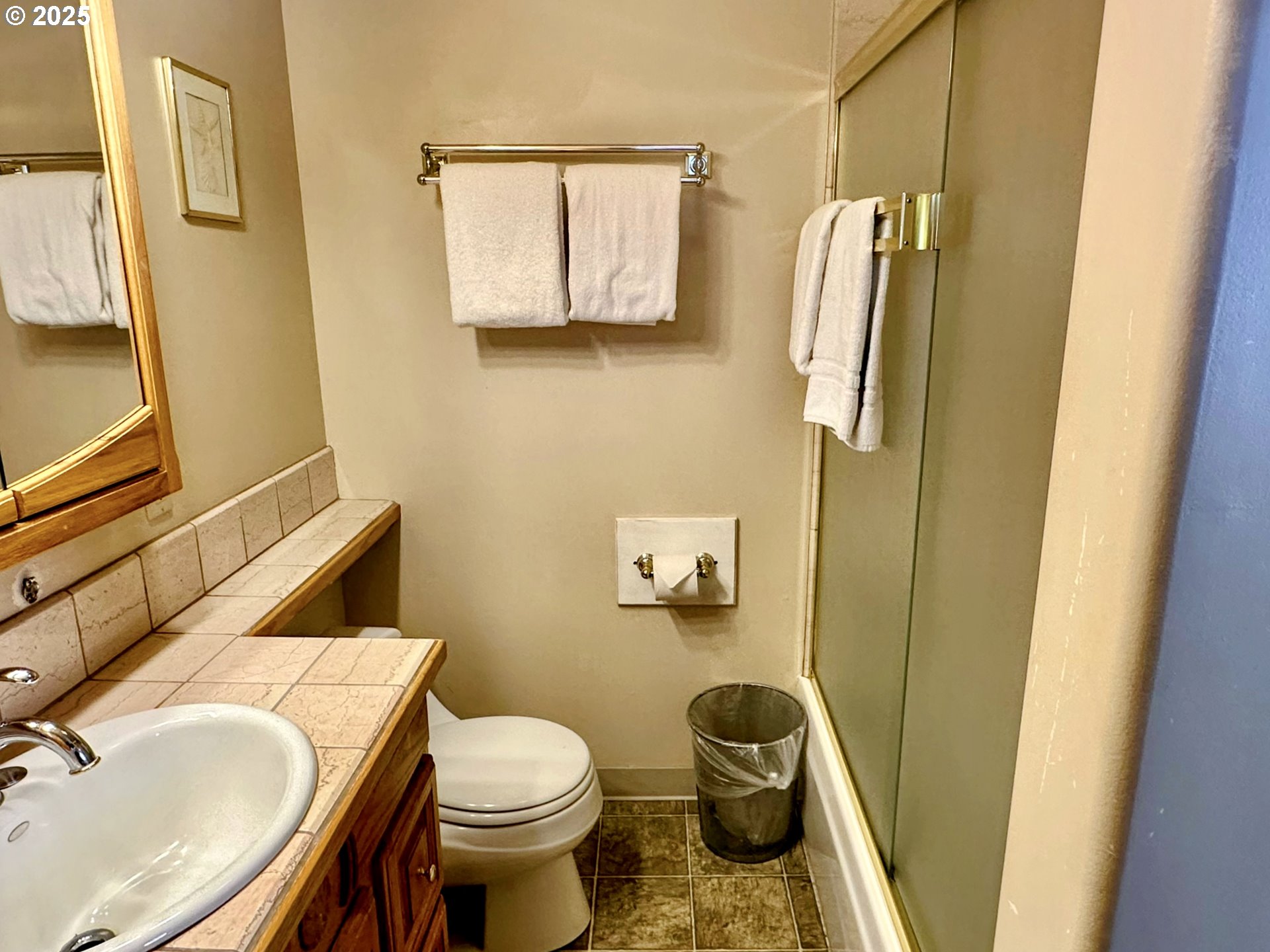 26230 Sandlake Road Cloverdale, OR 97112 - Photo 11 of 44 a white toilet sitting next to a bathroom sink