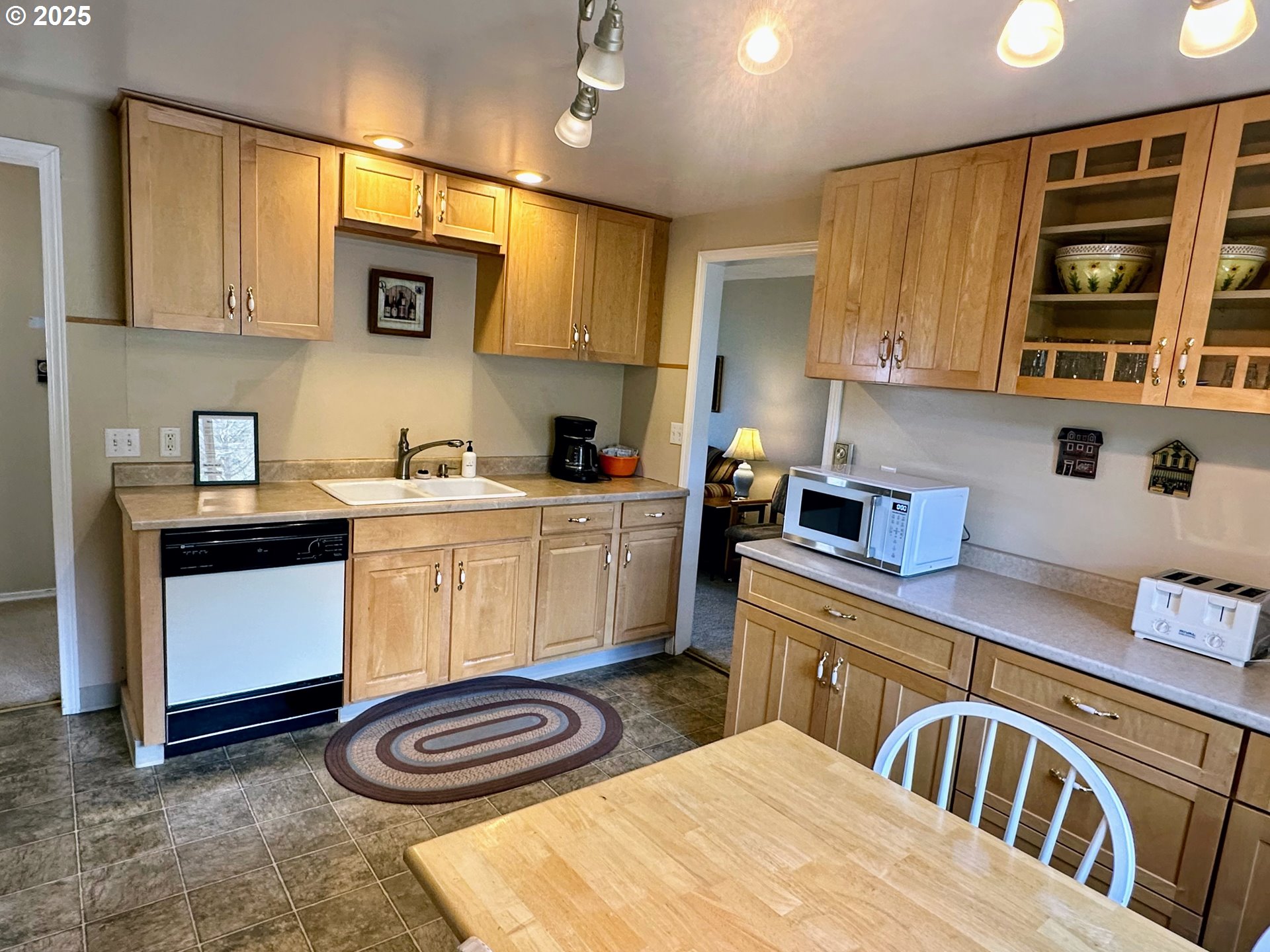 26230 Sandlake Road Cloverdale, OR 97112 - Photo 13 of 44 a kitchen with a sink cabinets and window