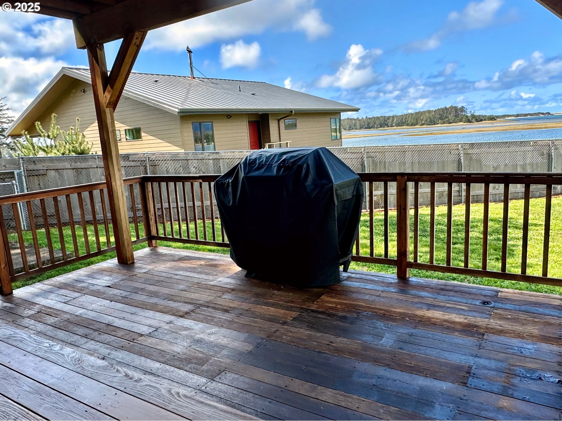 26230 Sandlake Road Cloverdale, OR 97112 - Photo 15 of 44 a view of a porch with wooden floor and outdoor space