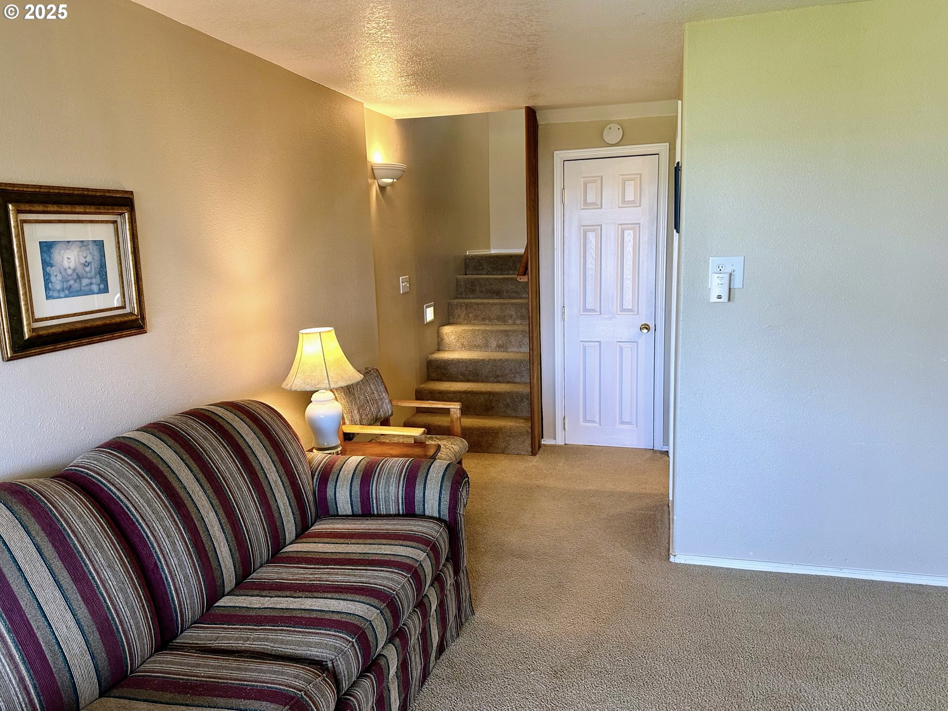26230 Sandlake Road Cloverdale, OR 97112 - Photo 19 of 44 a living room with a couch and a window