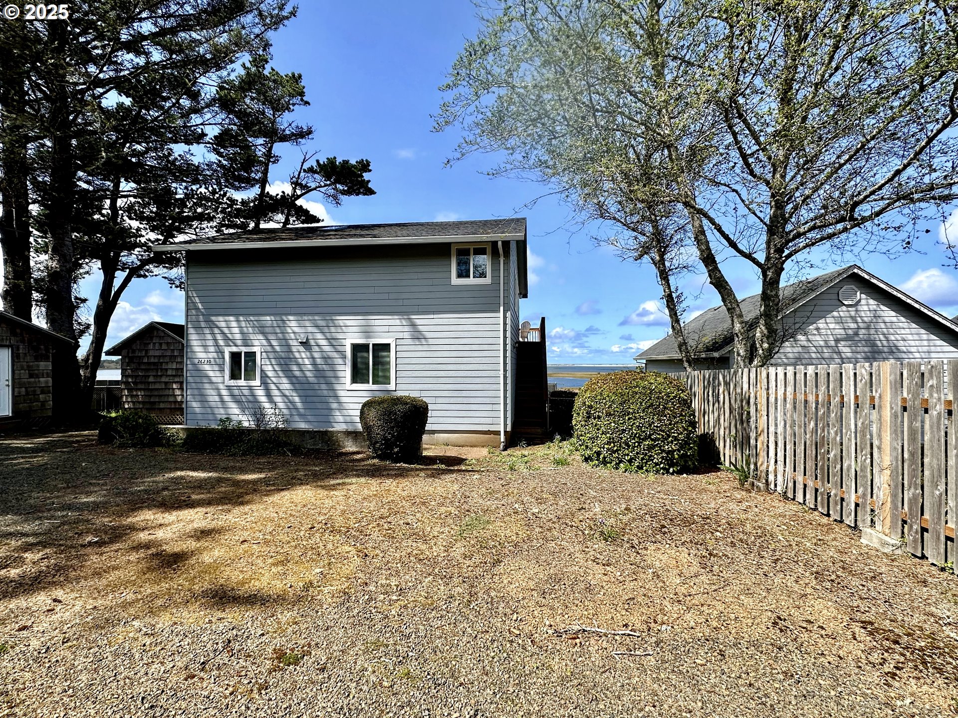 26230 Sandlake Road Cloverdale, OR 97112 - Photo 2 of 44 a view of a house with a yard covered in snow