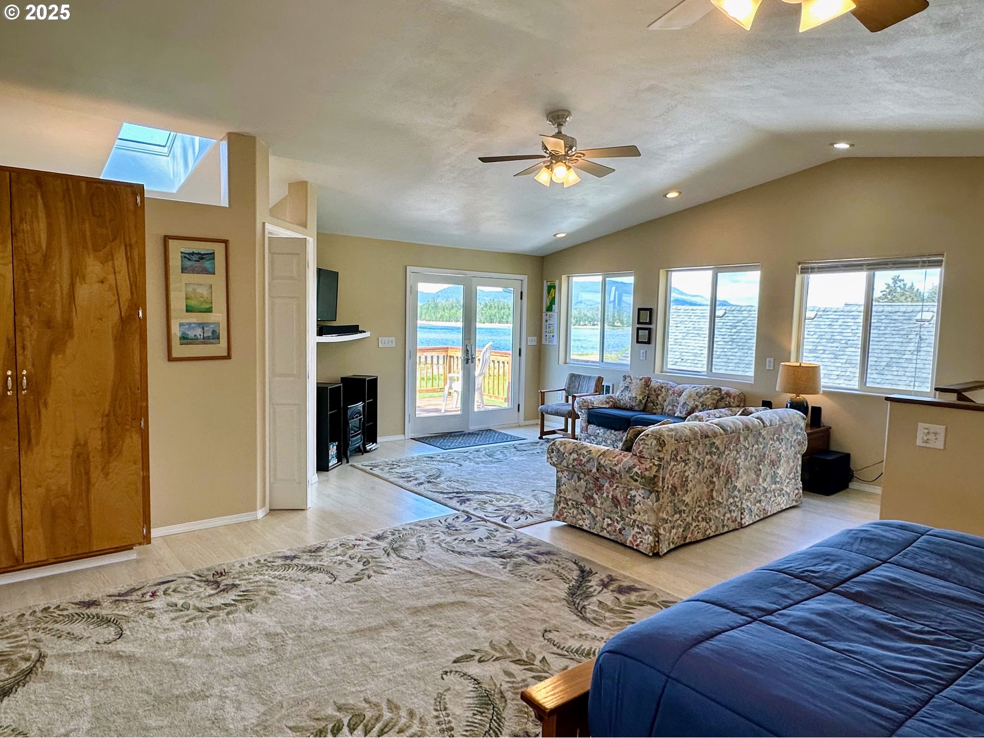 26230 Sandlake Road Cloverdale, OR 97112 - Photo 24 of 44 a living room with furniture and a large window