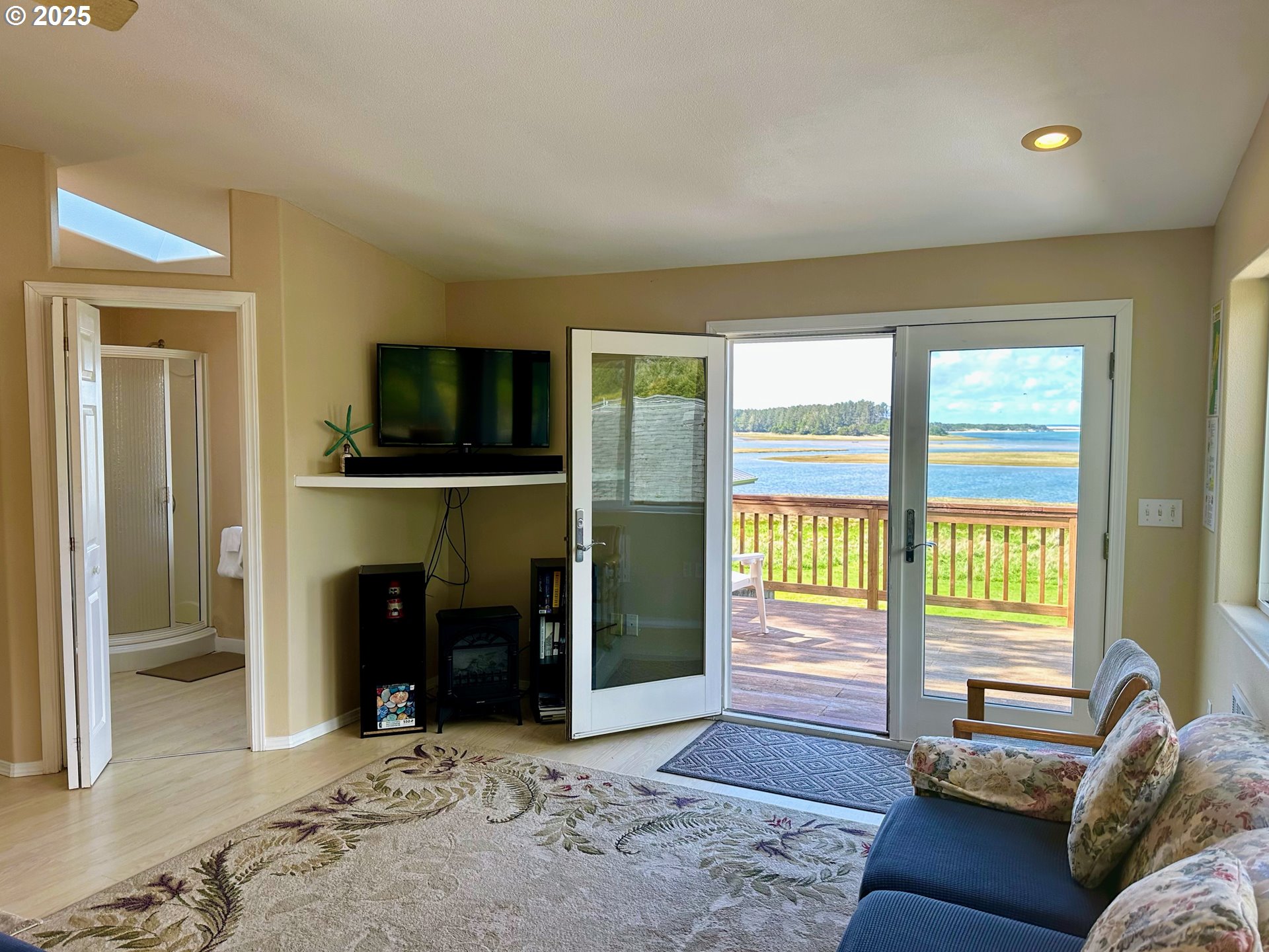 26230 Sandlake Road Cloverdale, OR 97112 - Photo 25 of 44 a living room with furniture and a fireplace