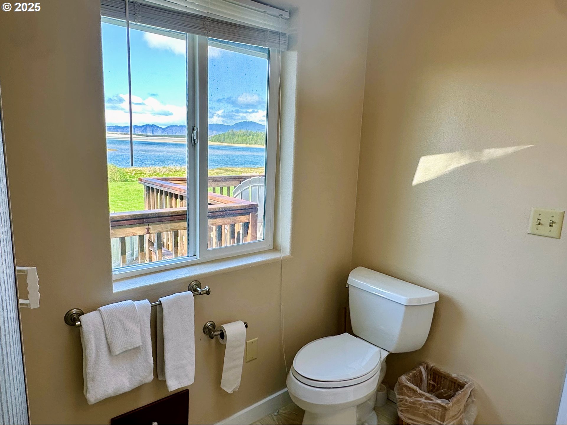 26230 Sandlake Road Cloverdale, OR 97112 - Photo 27 of 44 a white toilet sitting next to a bathroom sink