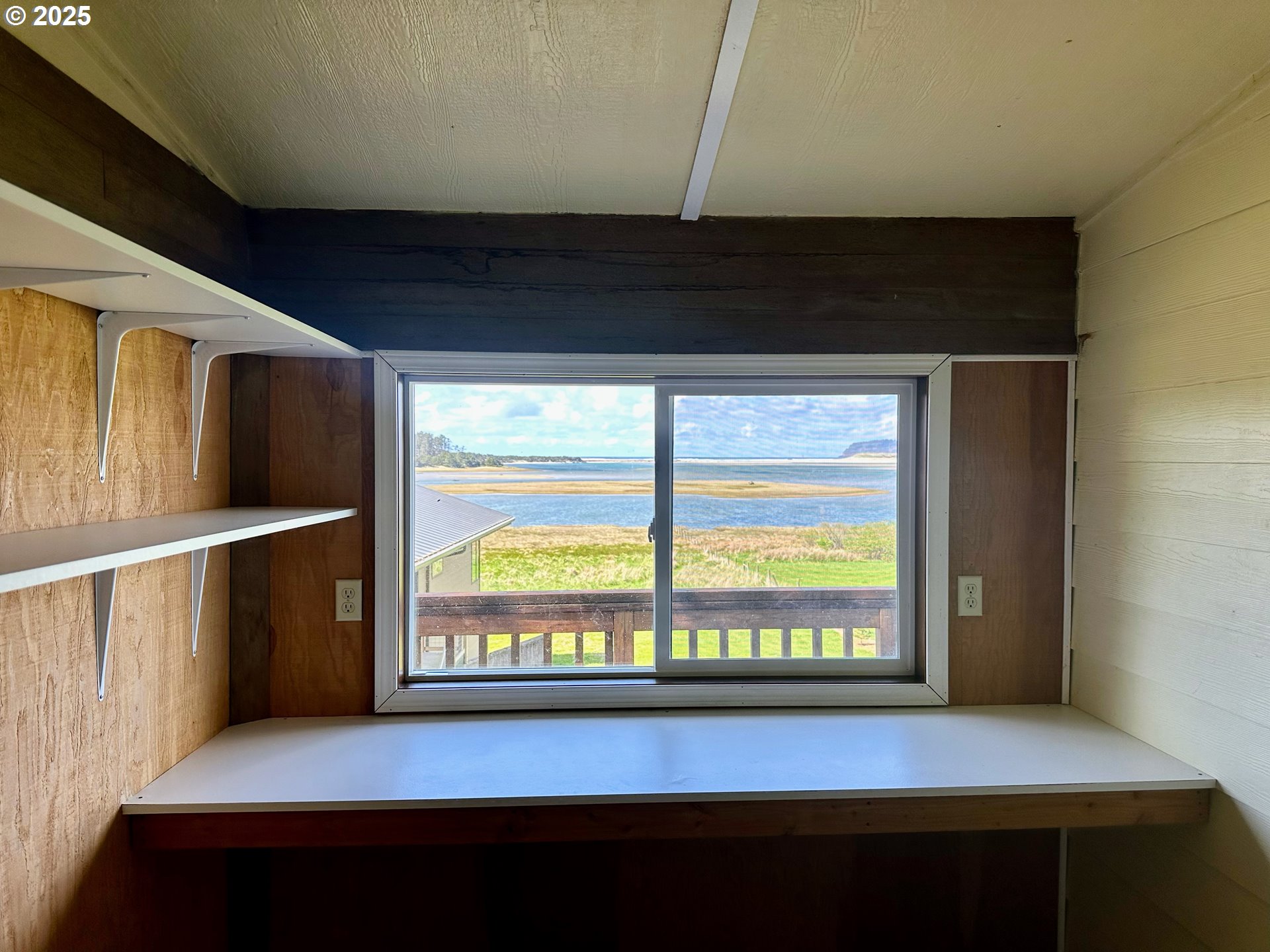 26230 Sandlake Road Cloverdale, OR 97112 - Photo 30 of 44 a view of an empty room with a window
