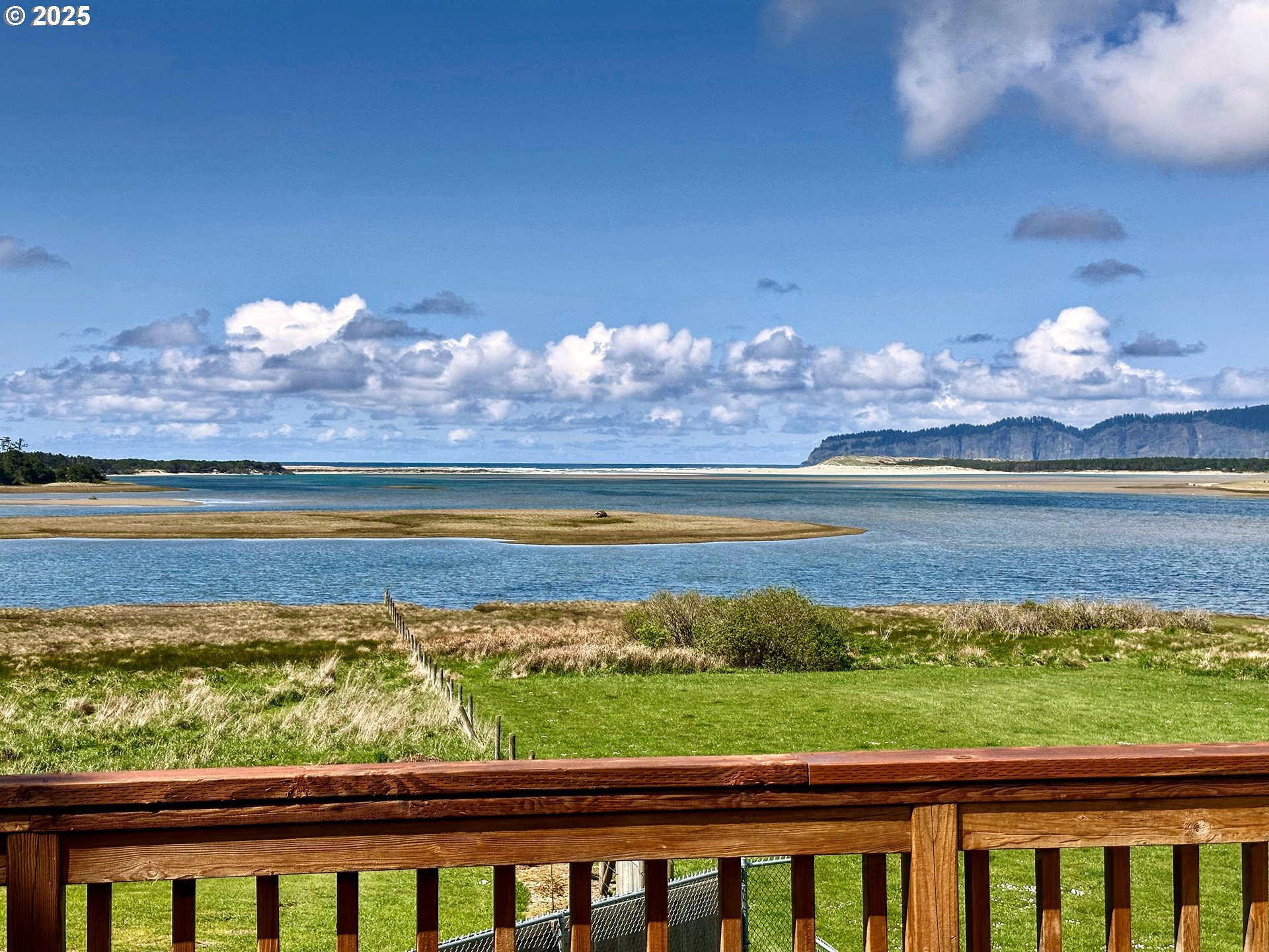 26230 Sandlake Road Cloverdale, OR 97112 - Photo 32 of 44 a view of a city from a lake