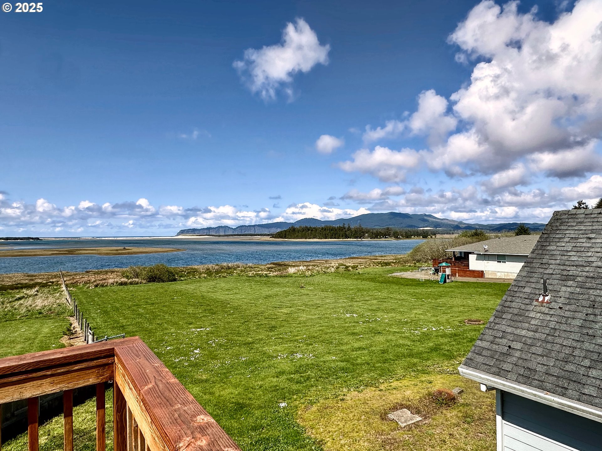 26230 Sandlake Road Cloverdale, OR 97112 - Photo 34 of 44 a view of a swimming pool with an outdoor seating and a yard