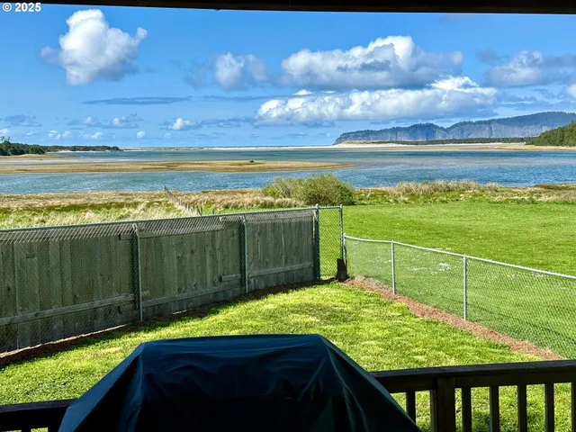 a view of a swimming pool with a open kitchen
