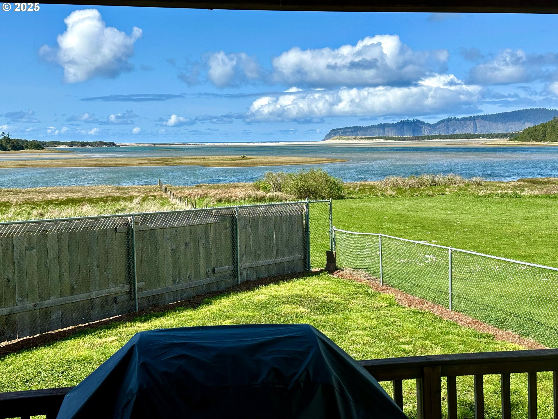 26230 Sandlake Road Cloverdale, OR 97112 - Photo 40 of 44 a view of a swimming pool with a open kitchen