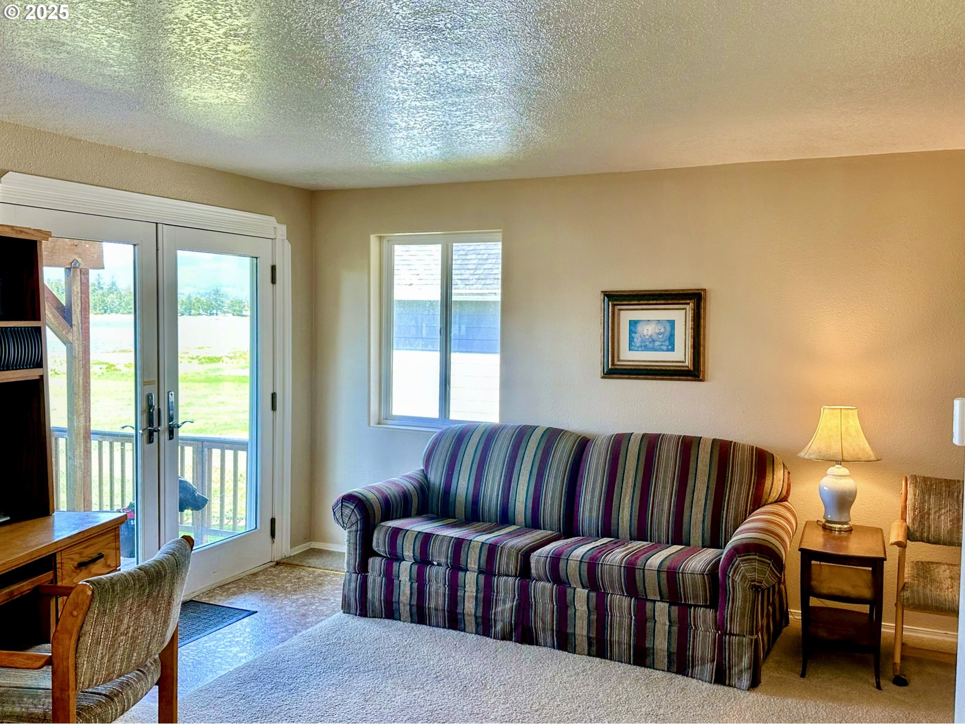 26230 Sandlake Road Cloverdale, OR 97112 - Photo 9 of 44 a living room with furniture and a potted plant