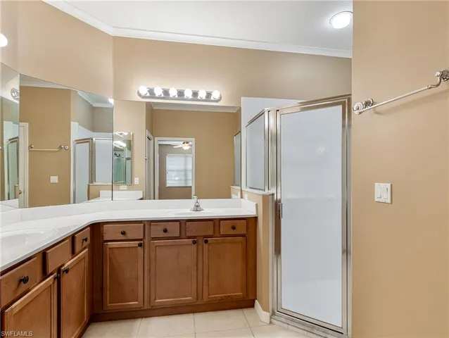 a bathroom with a double vanity sink and mirror