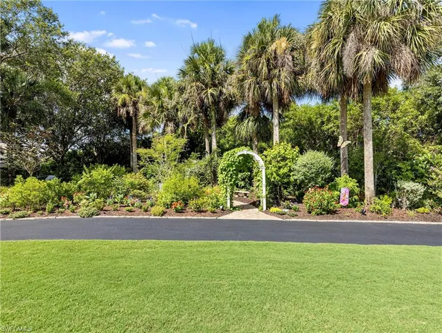 a view of a yard with a fountain