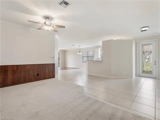 a view of a livingroom with a kitchen