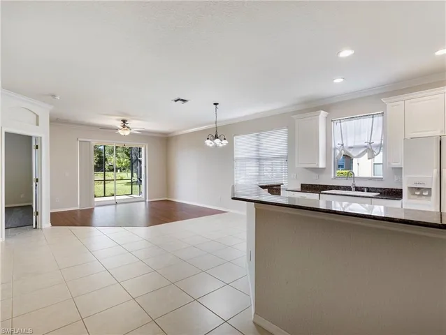 a kitchen with stainless steel appliances granite countertop a sink and a stove