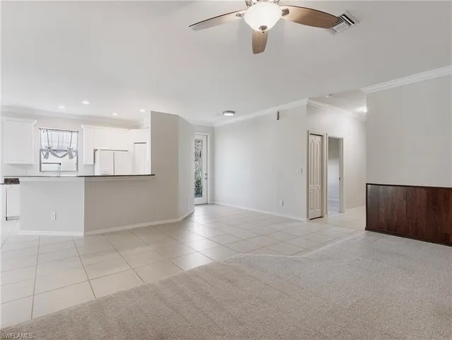 a view of a kitchen with a sink and cabinets