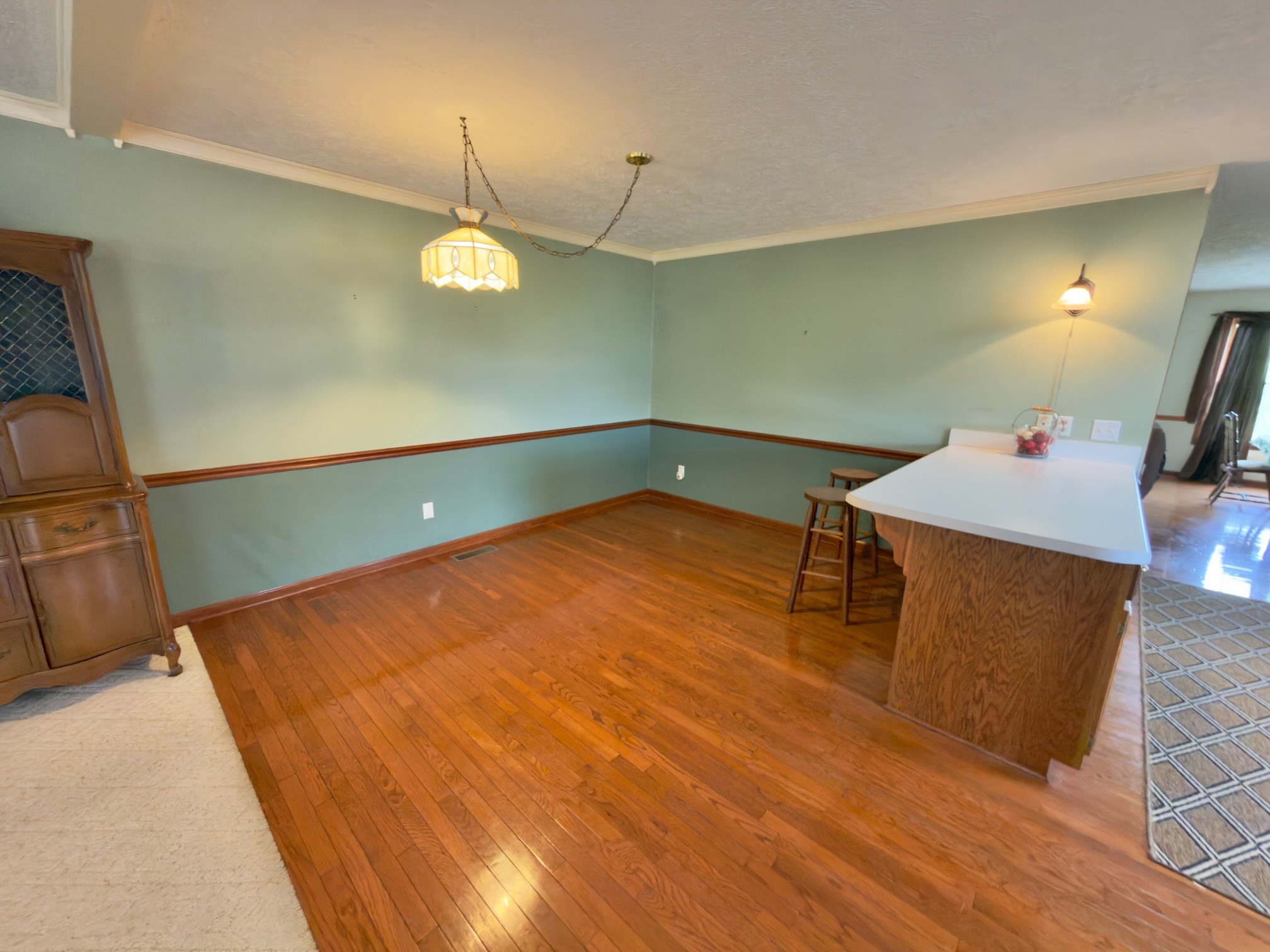 4929 Fountain Grove Road Morrison, TN 37357 - Photo 17 of 33 a room with wooden floor and chandelier