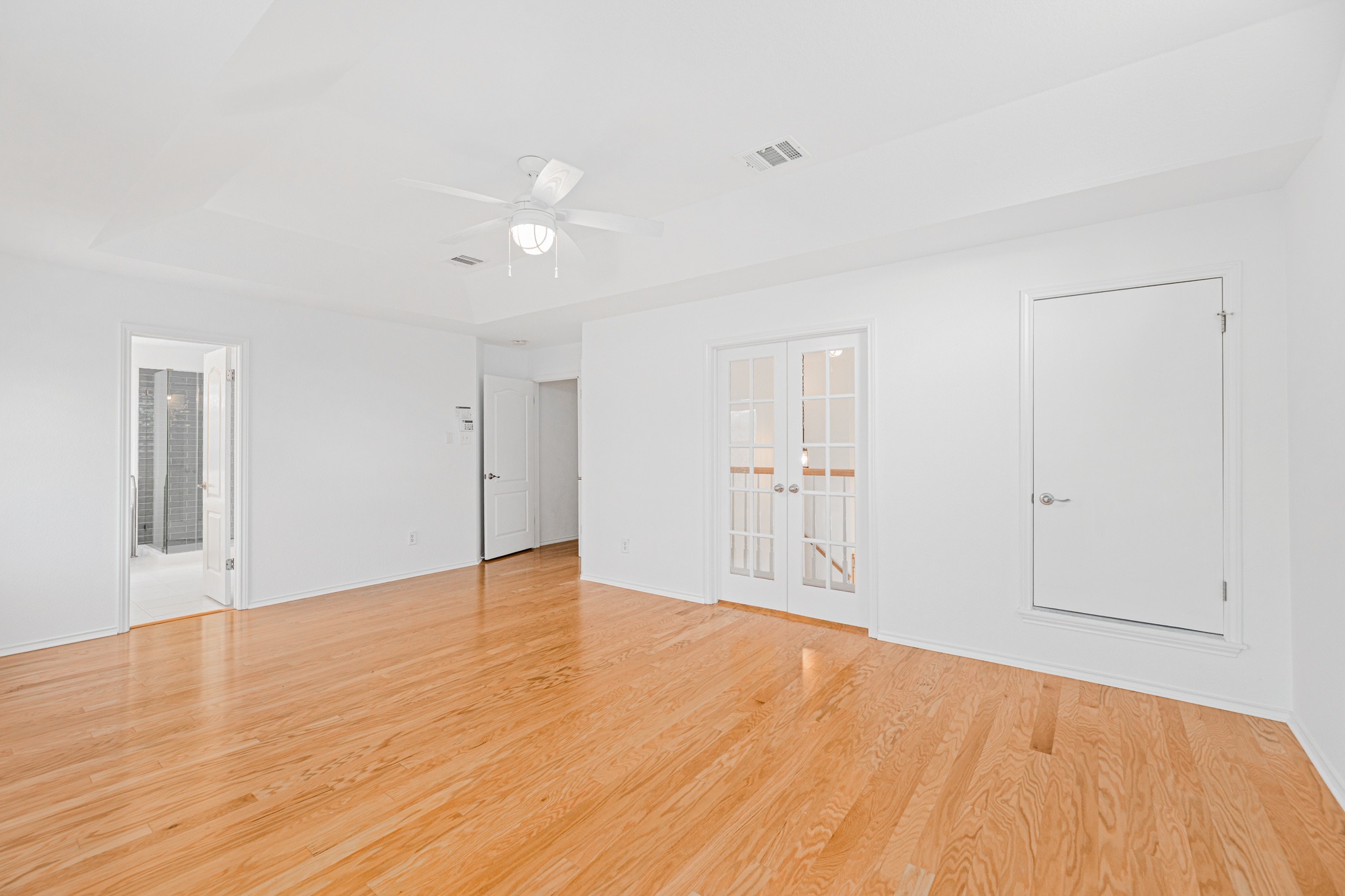 304 River Down Road Georgetown, TX 78628 - Photo 12 of 22 Spacious room featuring wood-finish flooring and a white ceiling fan