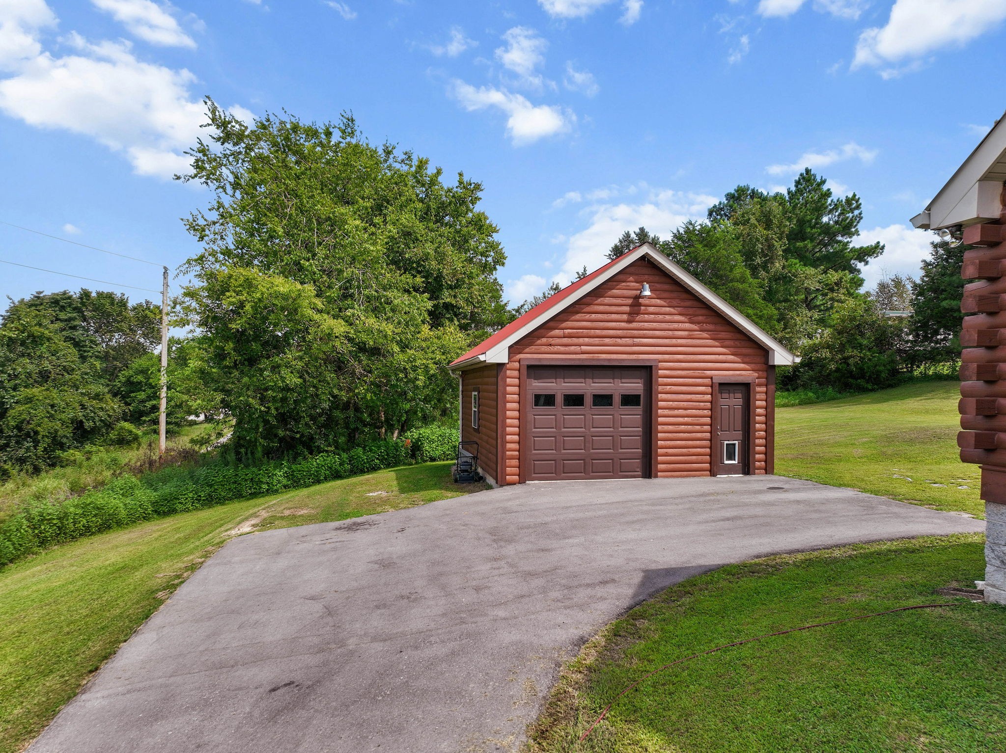 2301 Turner Road Watertown, TN 37184 - Photo 43 of 65 a view of a house with a yard and a garden