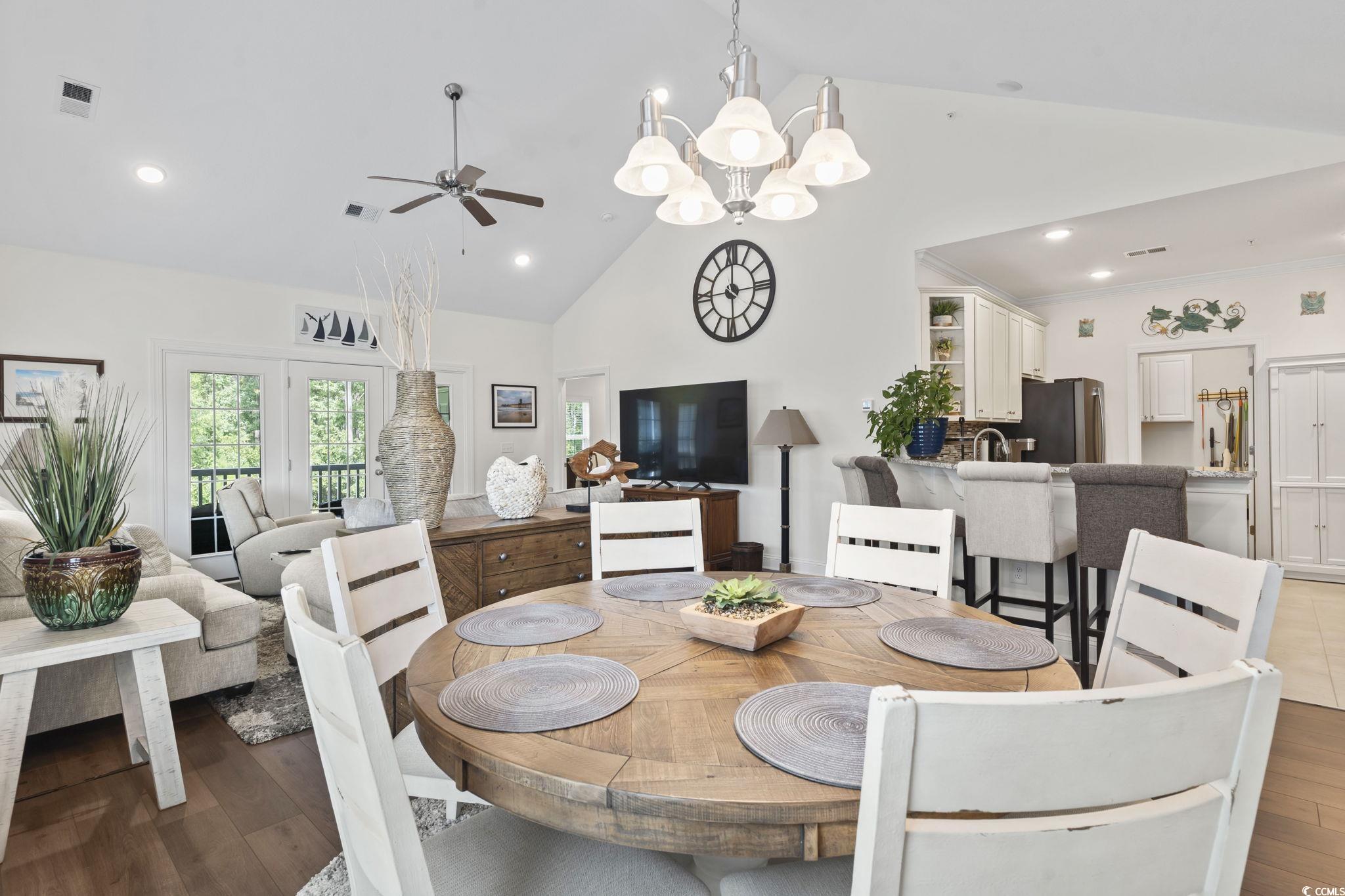 924 Jackline Place, Unit 201 Murrells Inlet, SC 29576 - Photo 14 of 35 Dining room featuring ceiling fan, high vaulted ceiling, a chandelier, recessed lighting, and wood finished floors