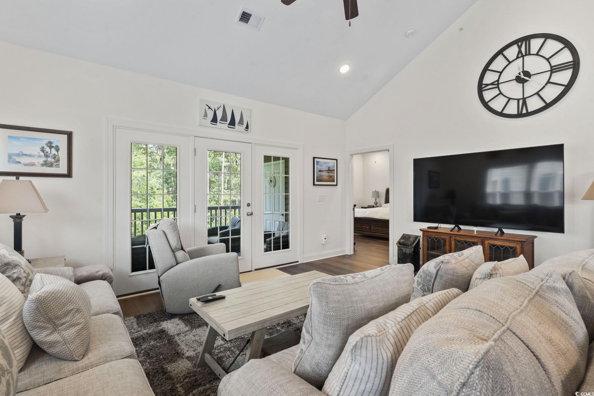 924 Jackline Place, Unit 201 Murrells Inlet, SC 29576 - Photo 16 of 35 Living area with french doors, high vaulted ceiling, wood finished floors, a ceiling fan, and recessed lighting