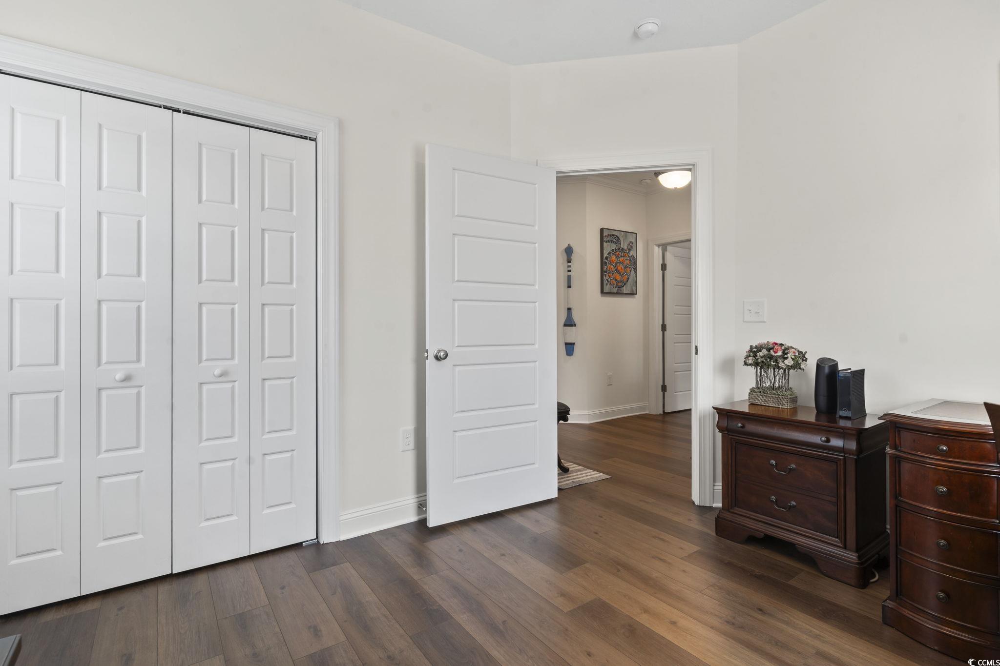 924 Jackline Place, Unit 201 Murrells Inlet, SC 29576 - Photo 20 of 35 Bedroom featuring dark wood-style floors and a closet