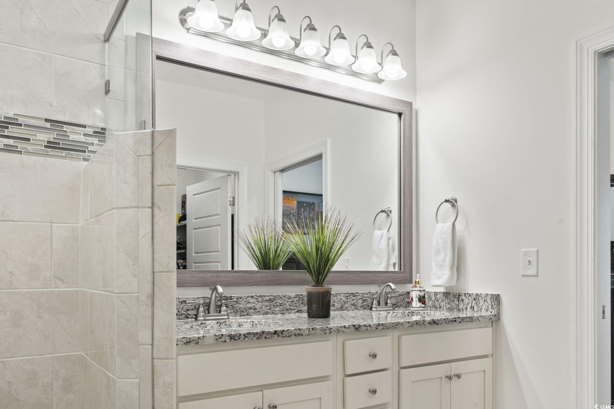 924 Jackline Place, Unit 201 Murrells Inlet, SC 29576 - Photo 21 of 35 Full bath with double vanity and a tile shower